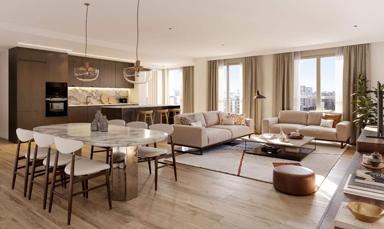 Zona de salón comedor con cocina abierta de una vivienda en The Avenue / Gestión Común
